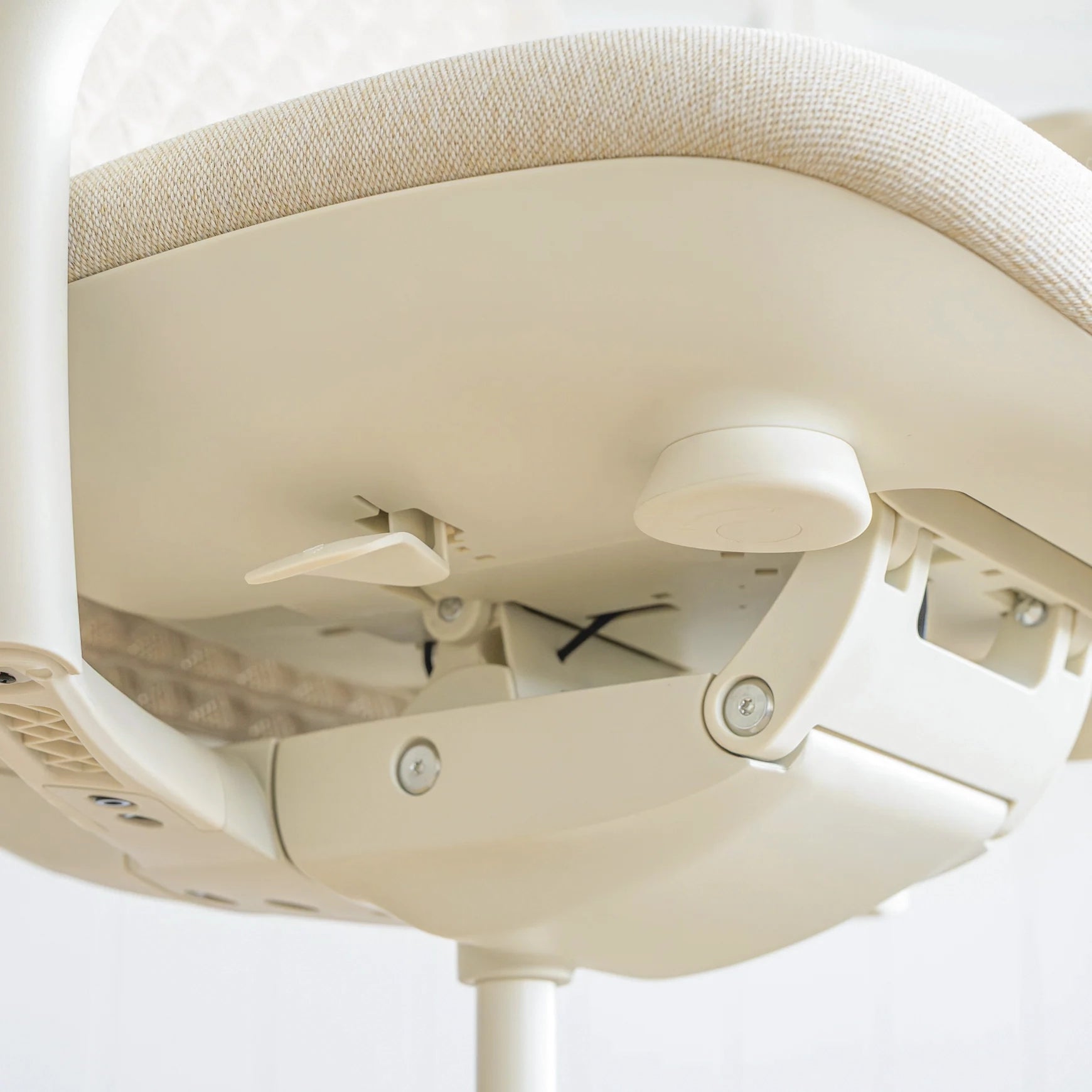 Pelicanwork Pro Ergonomic Mesh Chair in cream showing adjustable office chair mechanism