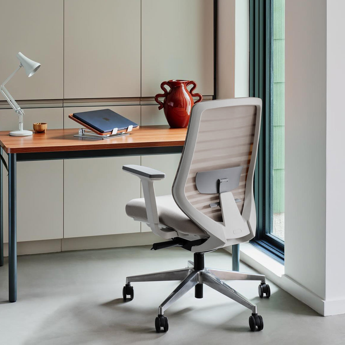 Pelicanwork ergonomic office chair in light gray color in a modern workspace