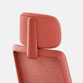 Verve Chair ergonomic office chair in coral color with adjustable headrest detail