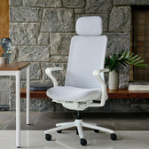 Pelicanwork Branch white ergonomic office chair with headrest in modern home office setting