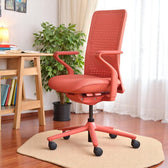 Model 92 coral ergonomic office chair in a home office, comfortable and adjustable design