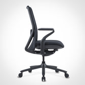 Pelicanwork Poly-8 ergonomic office chair in black, side view, modern design