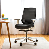 Pelicanwork Model 11 ergonomic office chair in black, mesh backrest, in modern workspace