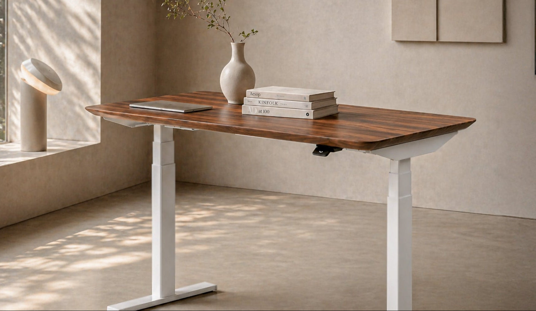 Wooden desk with white legs in a modern room with large windows
